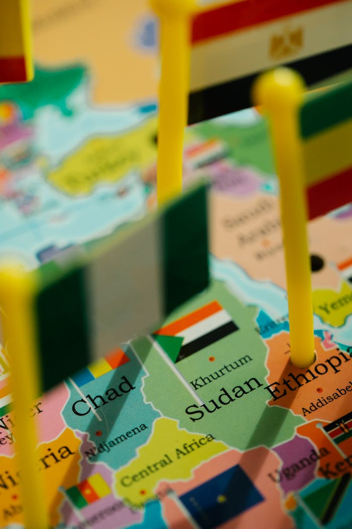 Closeup of African political map featuring flags of various countries with selective focus